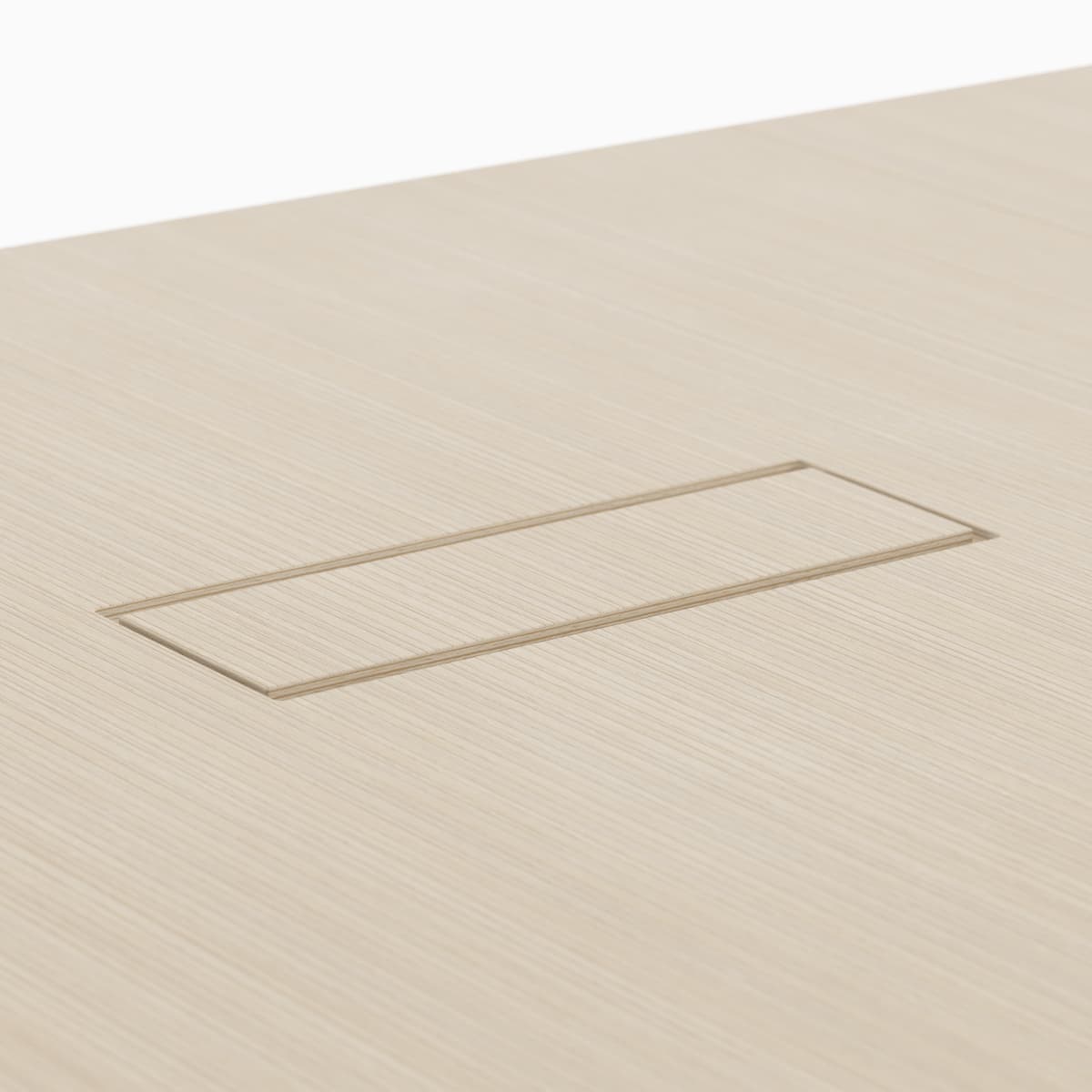 A detail view of the veneer power access cutout with available grain matching that easily brings power and data from the floor to the surface of the table.
