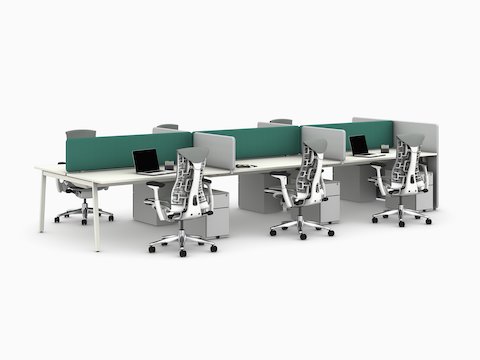 Green and grey Bound Screens mounted on a Layout Studio workstation with six stations, six grey Embody Chairs and six Kumi storage pedestals, viewed from an angle.