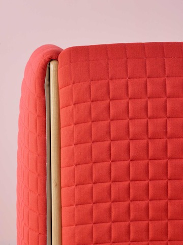 Close view of a red fabric on a ColourForm seating piece. 