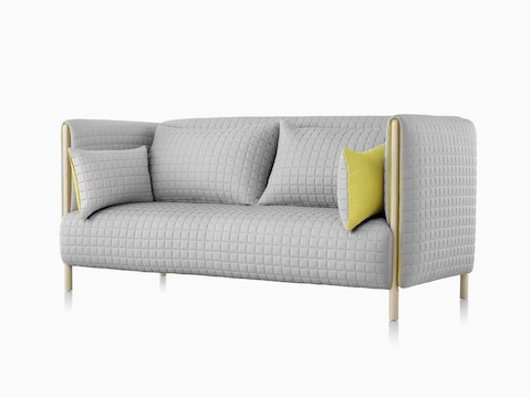 Oblique view of a light gray ColourForm sofa. 