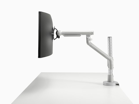 Flo Modular monitor arm in silver, viewed from the side.