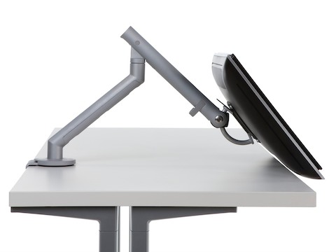 Profile view of a surface-attached Flo Monitor Arm adjusted at a low angle.