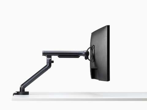 Flo Single monitor arm in black viewed from the side.
