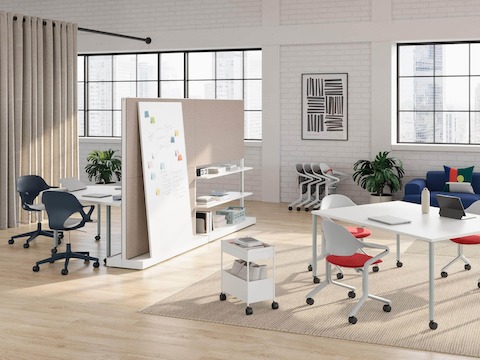 Fuld Chairs in Alpine with a Canyon seat pad are featured in a workshop setting with Zeph Chairs in Nightfall and OE1 Workspace Collection products including an OE1 Project Table, OE1 Agile Wall, OE1 Huddle Table and OE1 Storage Trolley.