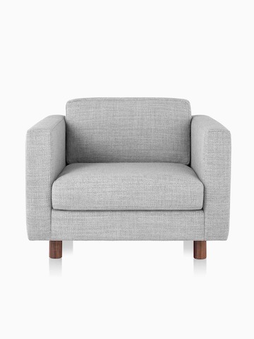 A Lispenard club chair with grey fabric upholstery and walnut wood legs, viewed from the front at a low angle.