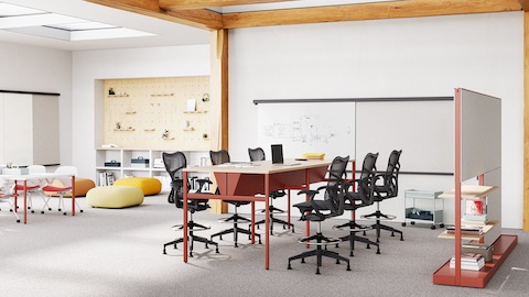 Profile view of an orange Mirra 2 Stool.