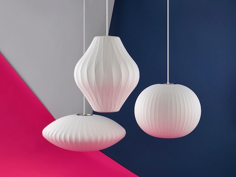 Three hanging Nelson Bubble Pendant lamps.