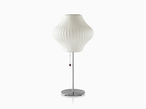 A white Nelson Pear Lotus Table Lamp with a steel base.