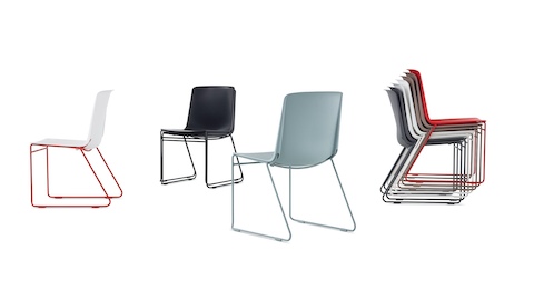 A group of multi-coloured Pronta Stacking Chairs.