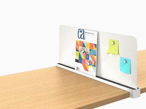 A Ubi Slim Screen props up a catalog and displays sticky notes with magnets.