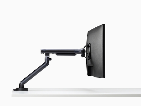 Flo Single monitor arm in black viewed from the side.