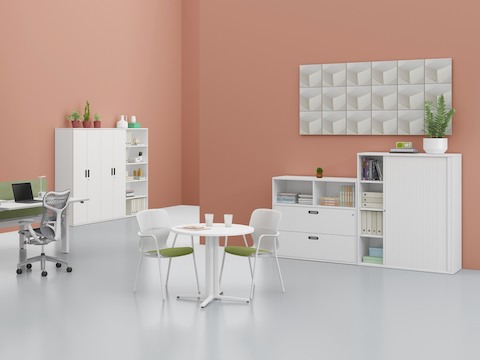 Various Paragraph Storage elements, including a cabinet, drawer unit, open modules, and lockers, support an interaction space.