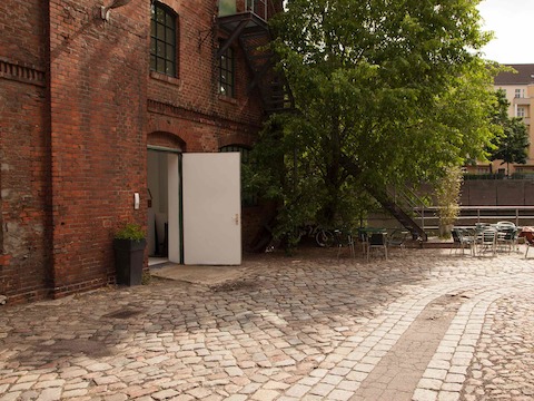 The Einstein room also has a back door onto the south-facing patio, which is adjacent to the coffee shop terrace, which the team can also use. Photo by Hello Design.