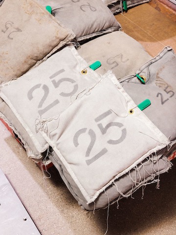 25-pound shot bags in gray fabric sit in a pile.