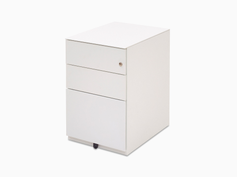 Front view of white Kumi pedestal with opened file drawer showing folders.