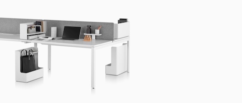 A benching setup supported by Ubi Work Tools, including mobile bag catches and desktop organisers.