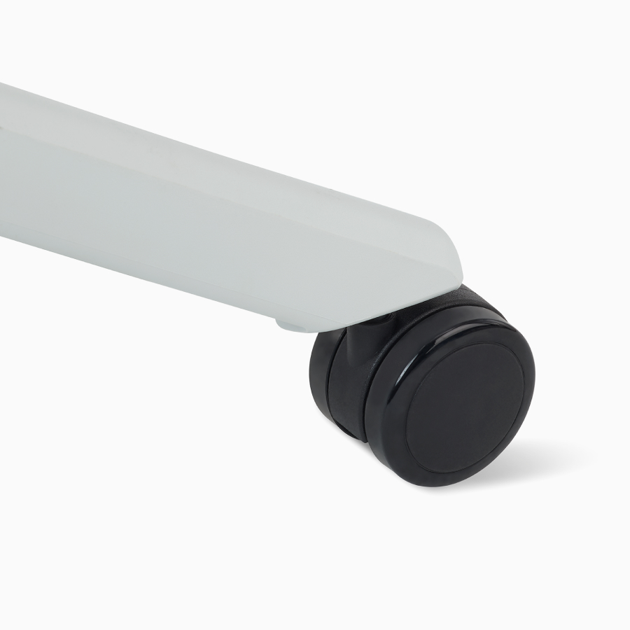 A close-up detail of the castor on a Fuld Nesting Chair.