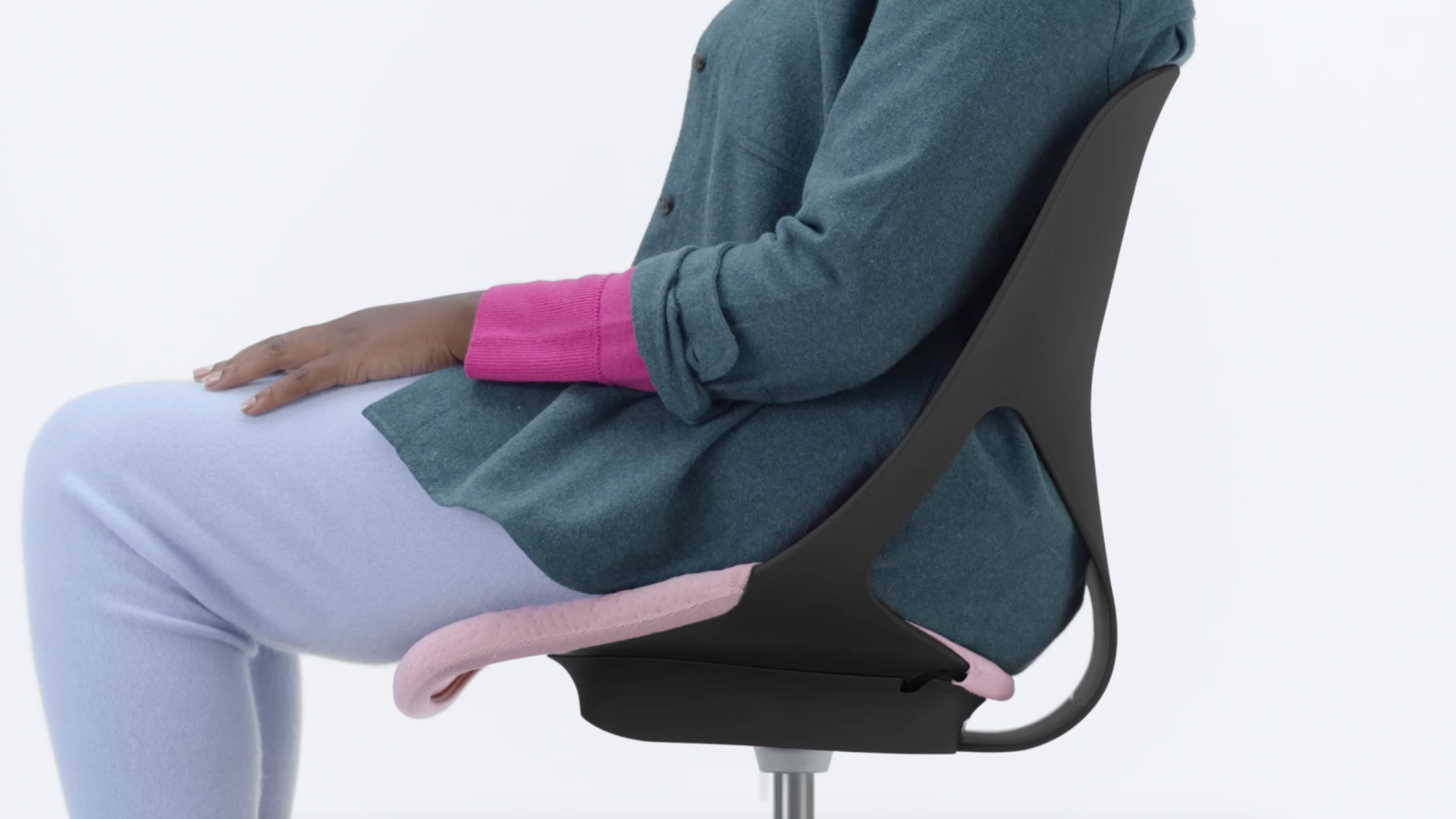 Side view of Zeph chair with a person sitting in it.