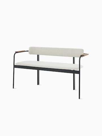 A Betwixt Bench with grey fabric seat and backrest, with walnut arms and a black frame.