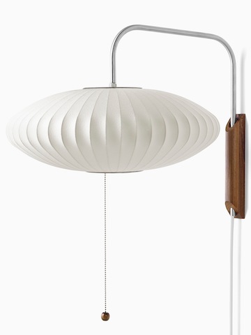 A white wall sconce. Select to go to the Nelson Saucer Wall Sconce product page.