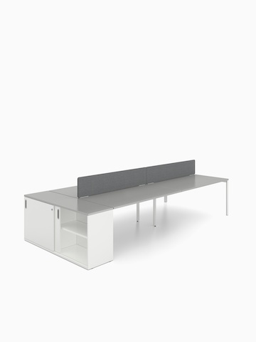 A white Paragraph Storage unit with a grey top positioned at the end of a Layout Studio benching configuration.