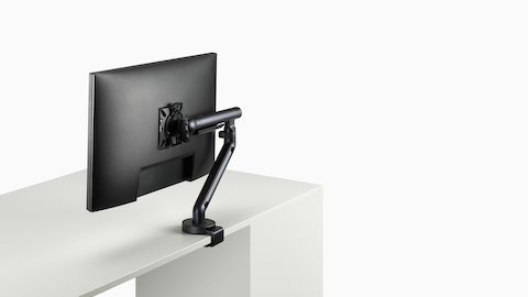 Flo Single monitor arm in black viewed at an angle.