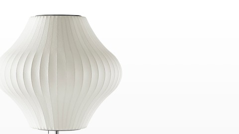 Close view of the white shade on a Nelson Pear Lotus Table Lamp.