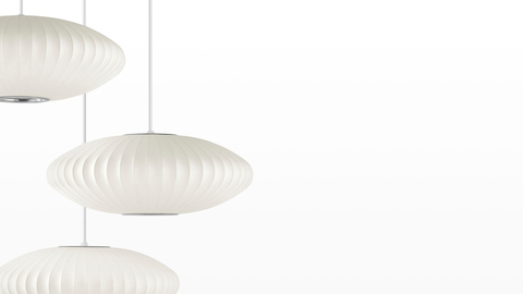 Three Nelson Saucer Bubble Pendants hanging from the same fixture.