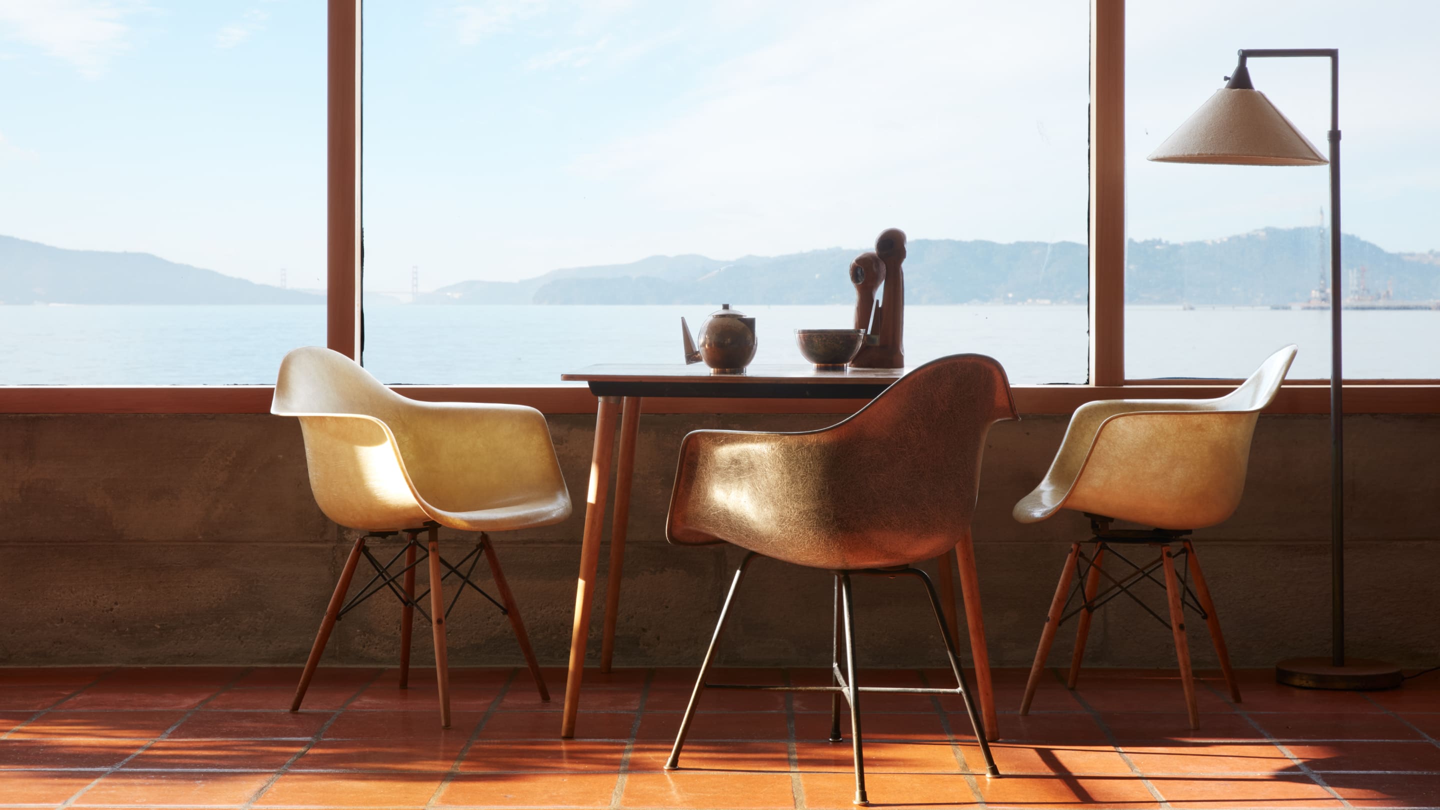 A trio of Eames vintage fibreglass armchairs in Steve Cabella's home overlooking San Francisco Bay.